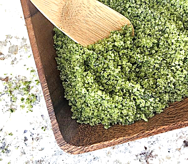 Green salt on aromatic herbs for festive dishes